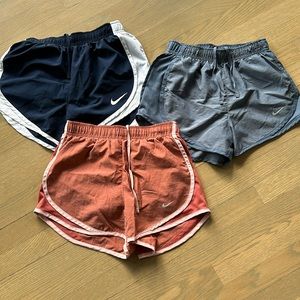 Nike Dri-Fit shorts, women’s xs.  3 pairs: 2 blue, one pink